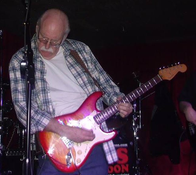 Man playing a guitar